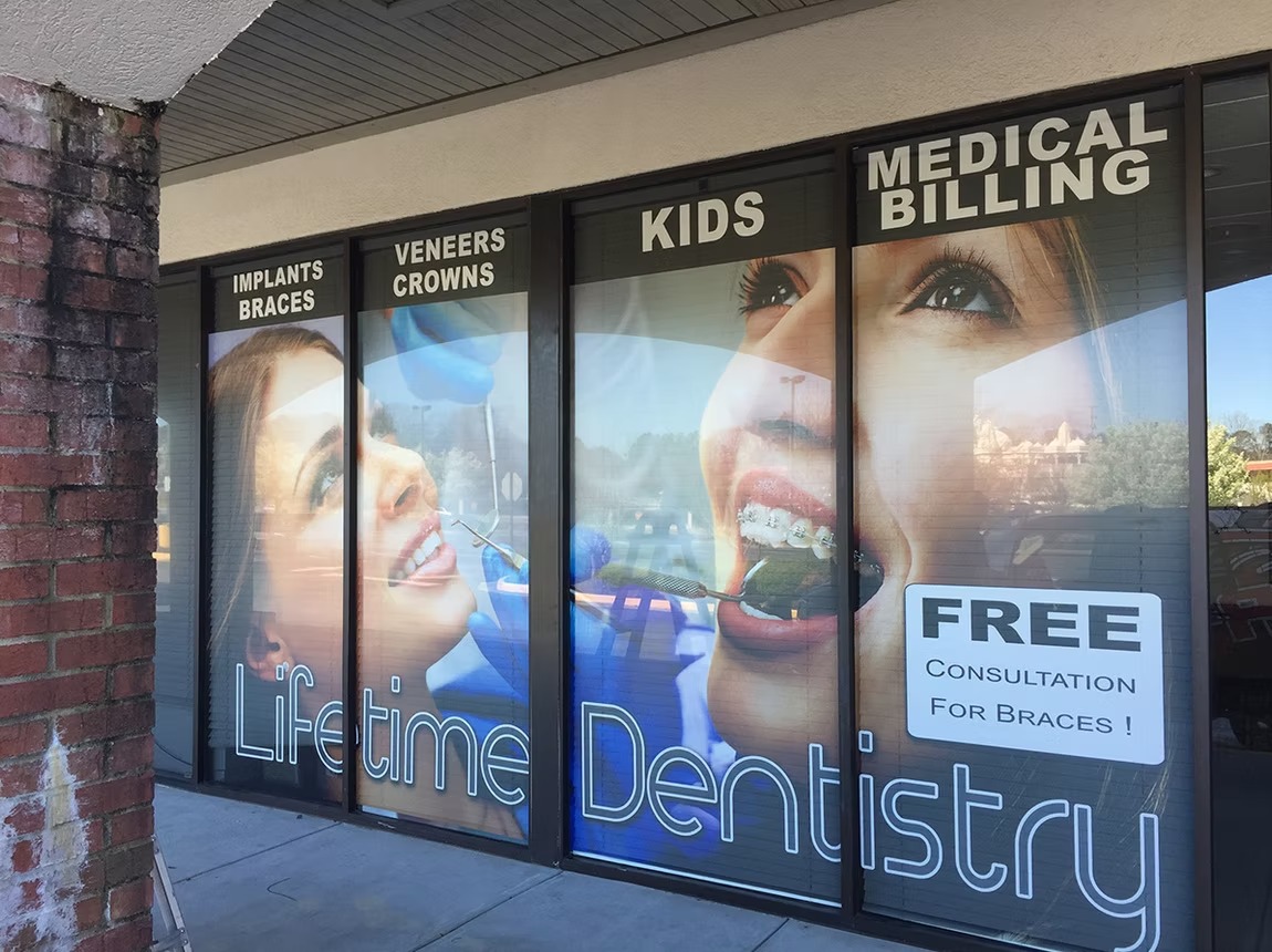 Lifetime Dentistry storefront with coordinated graphics across the windows